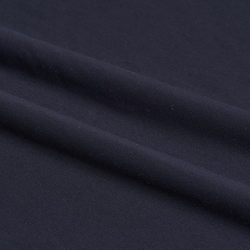 How does Hacci Fabric affect a garment's breathability and moisture absorption?