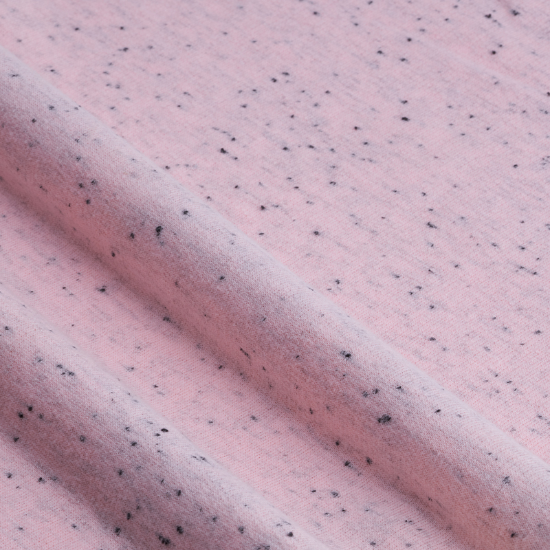 How does Hacci Fabric add unique layering and texture effects to clothing?